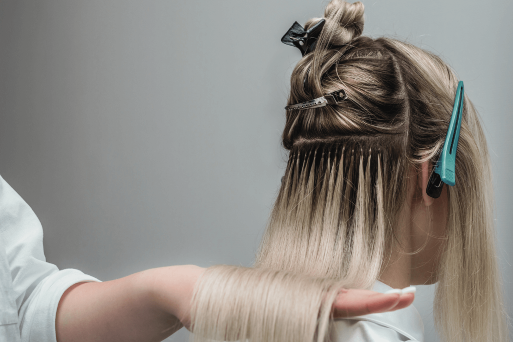 Professional hair extensions application at BossBeautyBar.