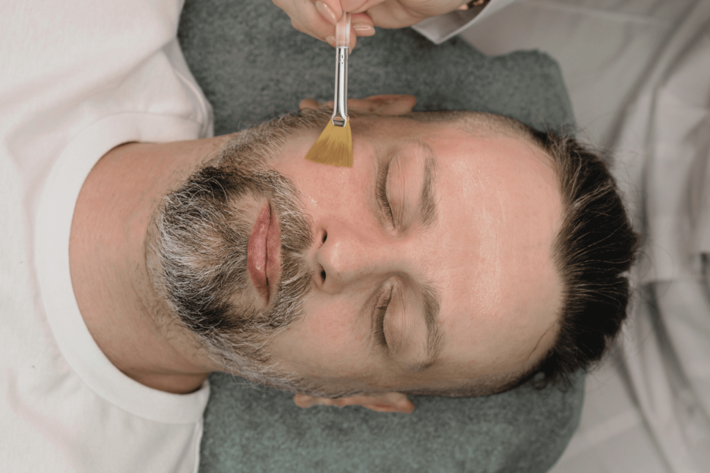 A man receiving a chemical peel treatment at BossBeautyBar.