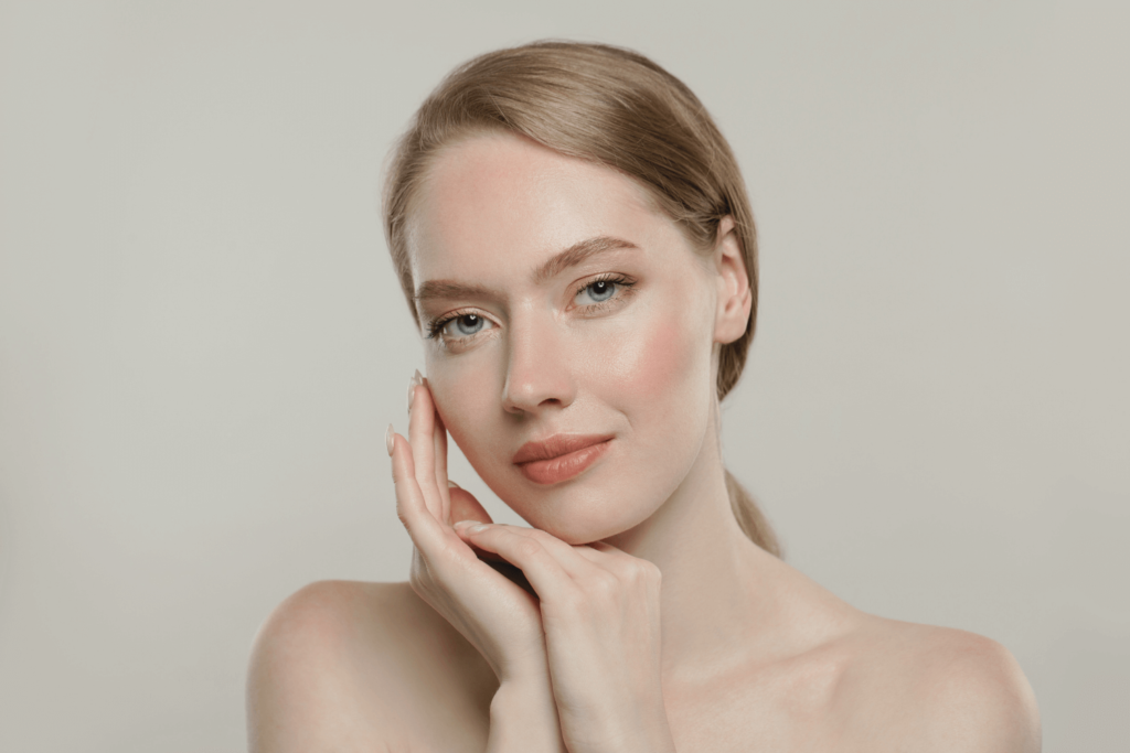 Woman with radiant, even-toned skin after Glutathione and Vitamin C injections at BossBeautyBar.